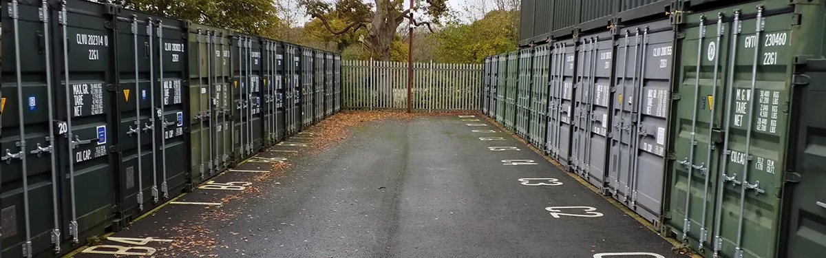 Aisle between rows of storage containers